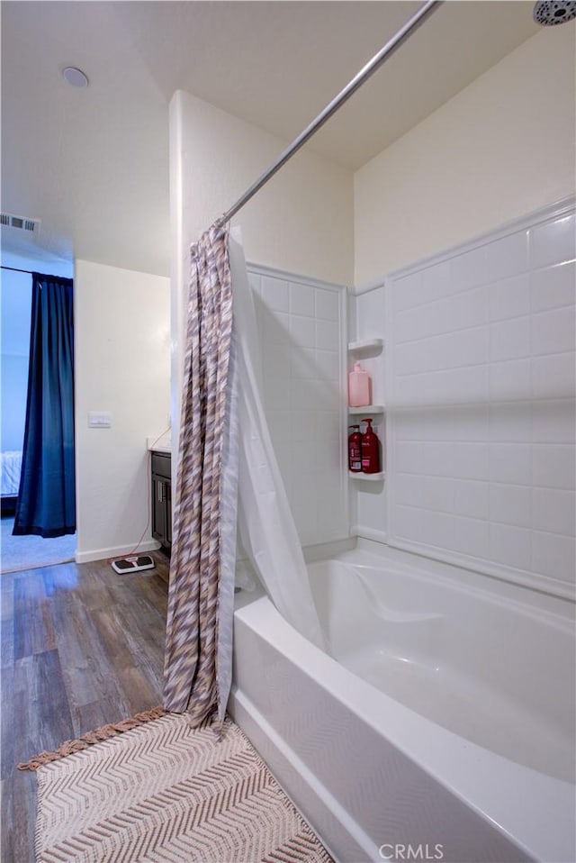 218 Bryce Canyon Ct, Merced, CA 95341 - bathroom featuring wood finished floors and shower / tub combo