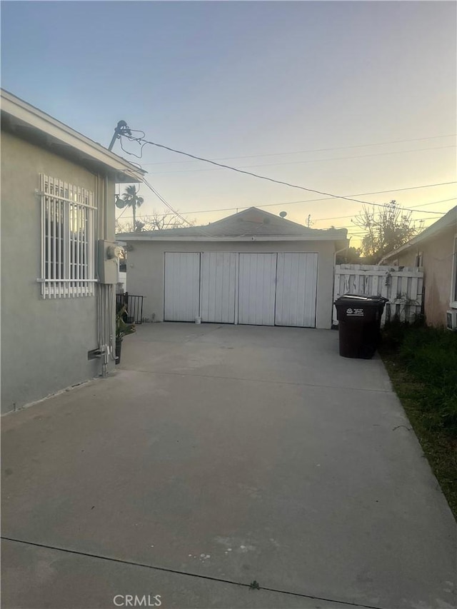 garage with fence