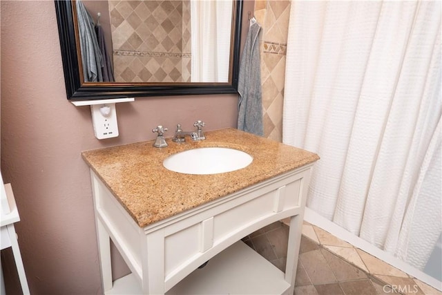 bathroom with curtained shower, tile patterned flooring, and vanity