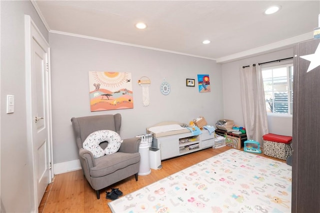 bedroom with recessed lighting, ornamental molding, and wood finished floors