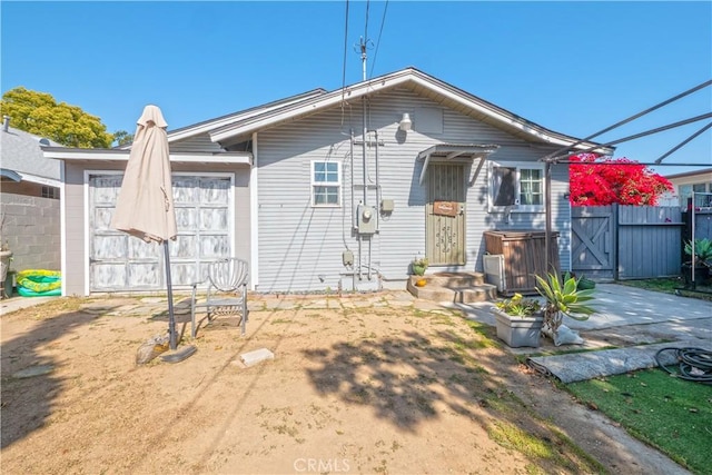 back of property with fence