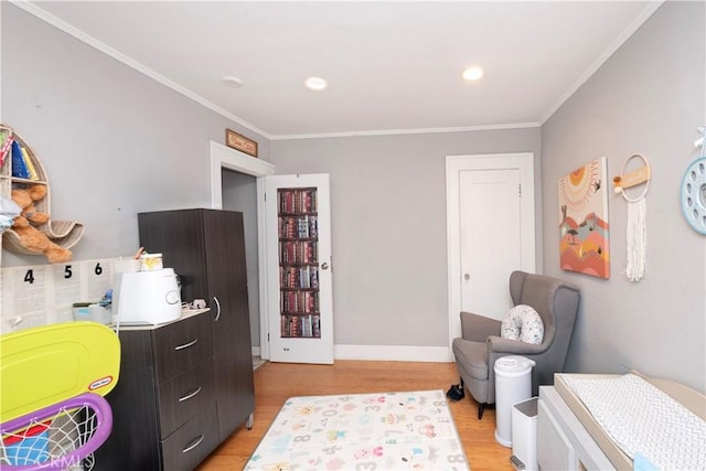 bedroom with light wood-type flooring, recessed lighting, baseboards, and crown molding