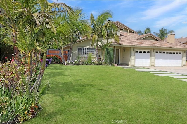 view of front of property featuring fence, driveway, a tile roof, a garage, and a front lawn