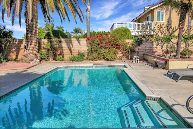view of pool featuring a patio area, a fenced in pool, and a fenced backyard