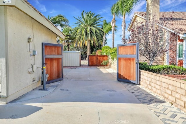 view of patio with a gate and fence