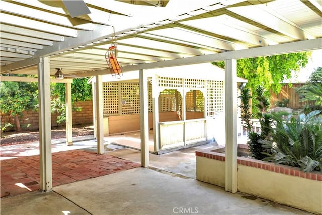 view of patio / terrace featuring a pergola and fence