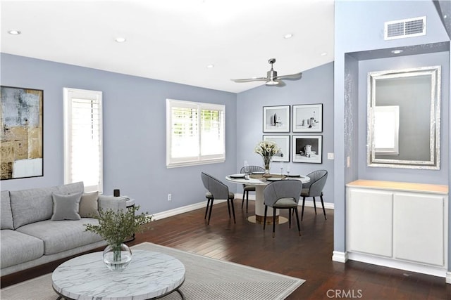 living room featuring a ceiling fan, baseboards, dark wood-style floors, and visible vents