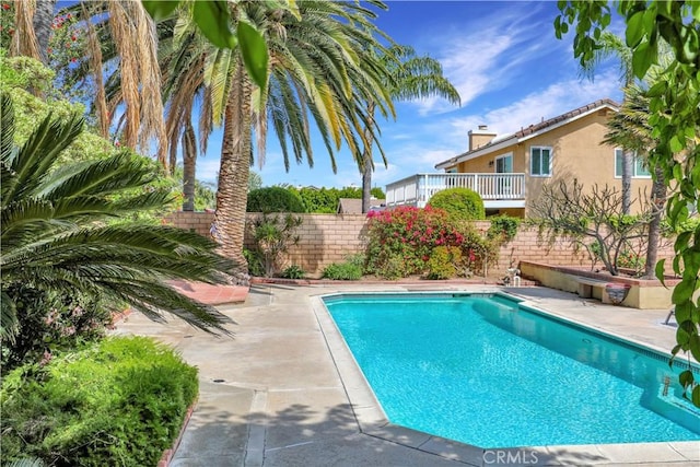 view of swimming pool with a fenced backyard, a patio area, and a fenced in pool