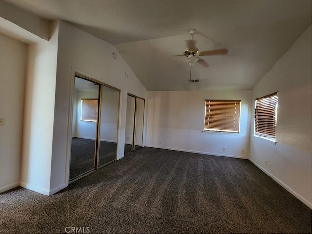 18580 Paskenta Rd, Corning, CA 96021 - unfurnished bedroom with multiple closets, vaulted ceiling, dark carpet, and visible vents