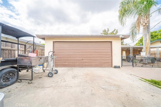 garage featuring fence