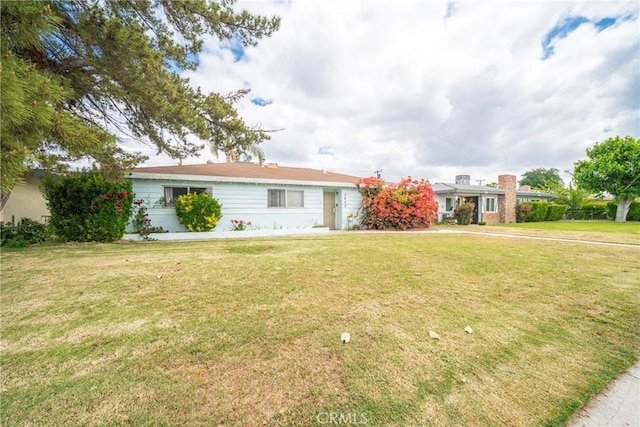 ranch-style house with a front lawn