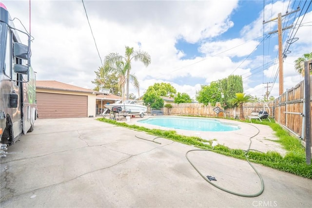 view of swimming pool with a fenced backyard and a fenced in pool