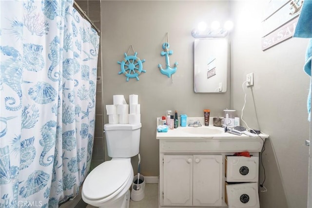 bathroom with baseboards, curtained shower, toilet, and vanity