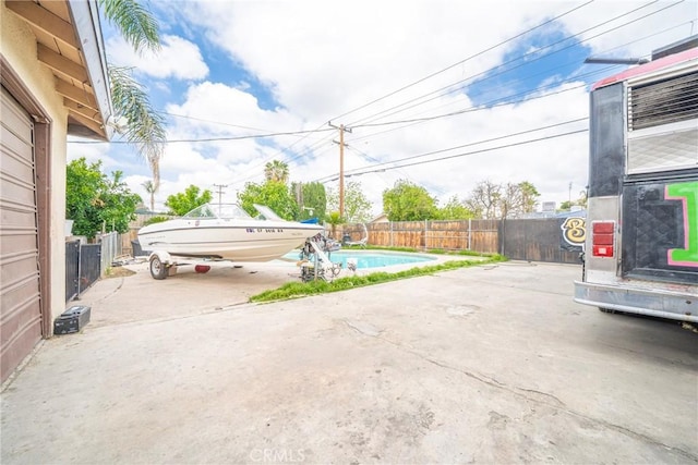 view of patio / terrace featuring a fenced in pool and a fenced backyard