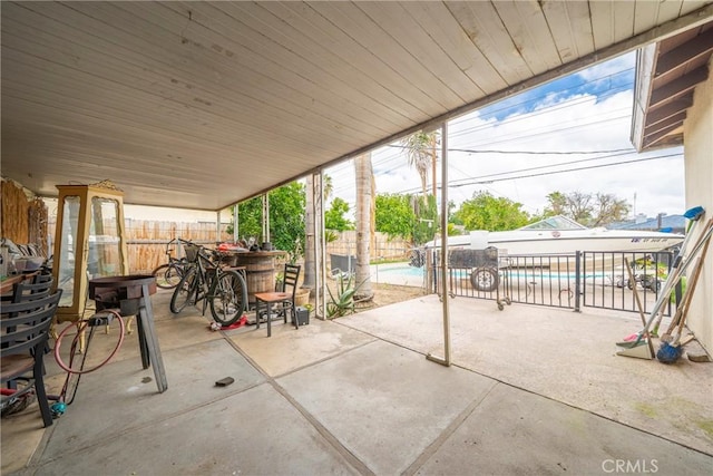 view of patio with a fenced in pool and a fenced backyard