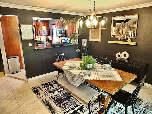 dining area featuring crown molding, baseboards, an inviting chandelier, and light tile patterned floors