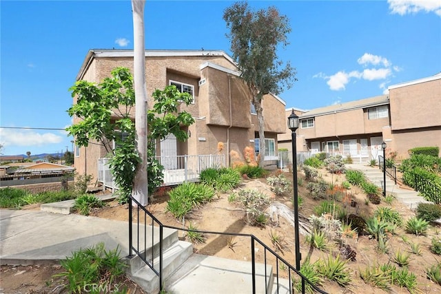 view of property with fence