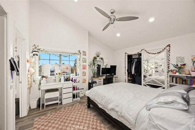 bedroom with high vaulted ceiling, a ceiling fan, recessed lighting, and wood finished floors