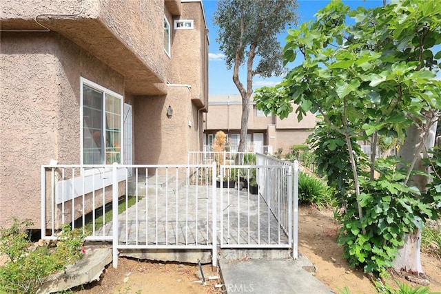 exterior space with stucco siding