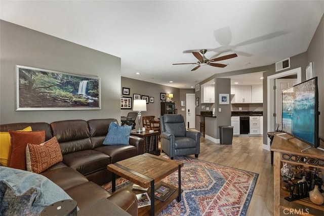 living area featuring recessed lighting, ceiling fan, visible vents, and light wood-type flooring