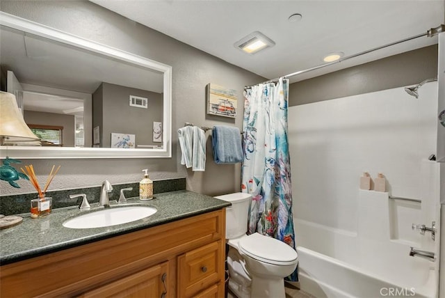 bathroom featuring visible vents, shower / tub combo with curtain, toilet, and vanity
