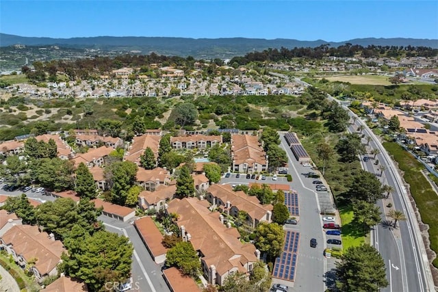 drone / aerial view with a residential view and a mountain view