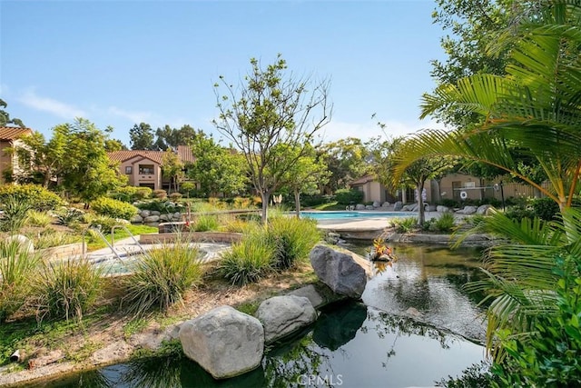 surrounding community with a pool