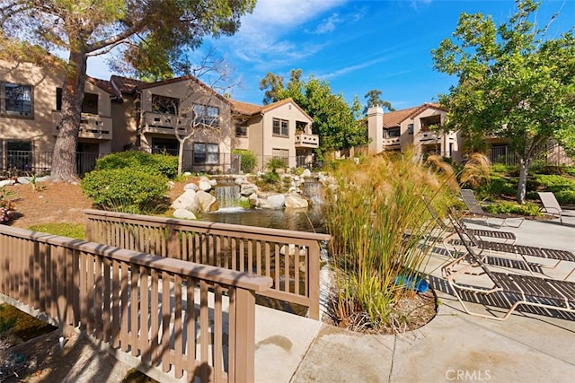 view of home's community with a patio and a residential view