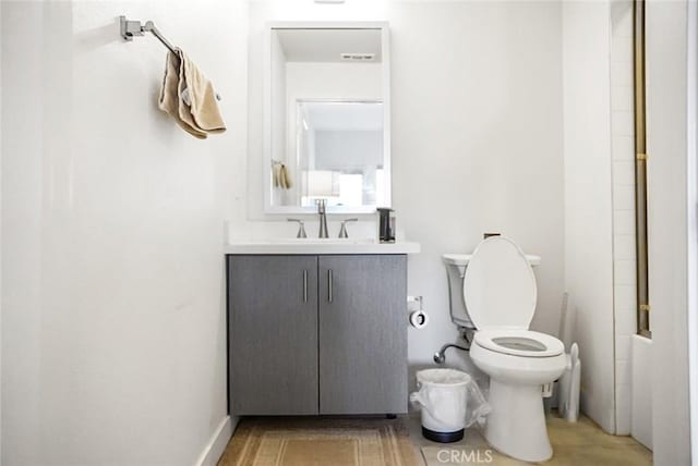 full bathroom featuring vanity and toilet