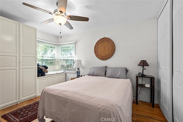 bedroom featuring light wood-type flooring and ceiling fan