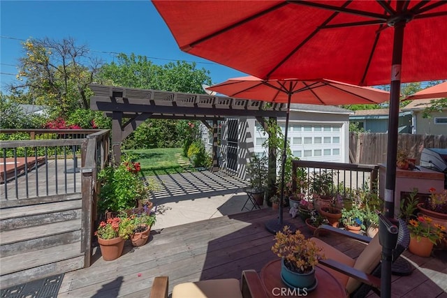 view of patio / terrace featuring fence and a deck