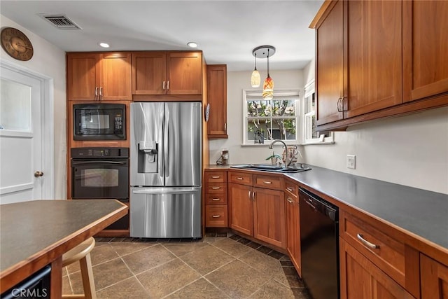 17557 Gilmore St, Lake Balboa, CA 91406 - kitchen featuring black appliances, a sink, brown cabinetry, recessed lighting, and dark countertops