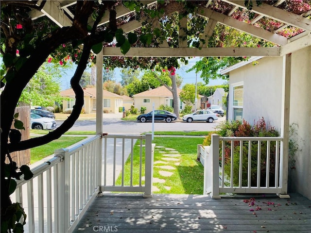 17557 Gilmore St, Lake Balboa, CA 91406 - wooden porch featuring a residential view and a lawn