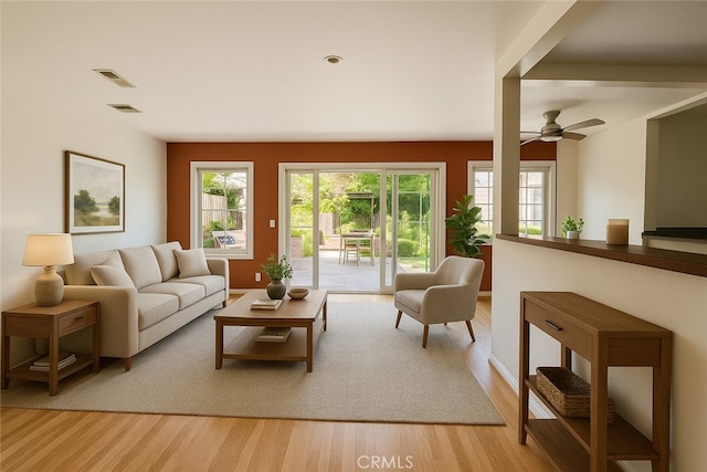 17557 Gilmore St, Lake Balboa, CA 91406 - living area with plenty of natural light, light wood-style floors, and a ceiling fan