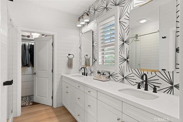 112 Gemstone, Irvine, CA 92620 - bathroom with wood finished floors, a sink, a stall shower, and double vanity