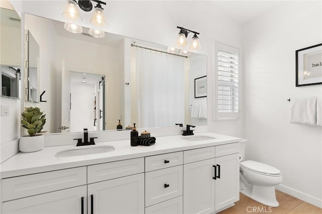 112 Gemstone, Irvine, CA 92620 - bathroom featuring a sink, toilet, double vanity, and visible vents