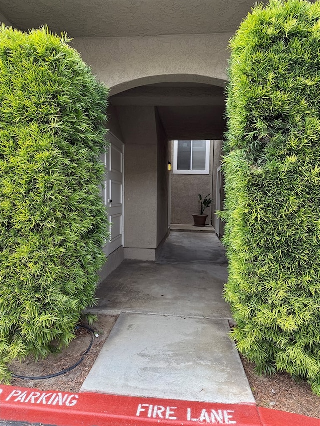 view of exterior entry with stucco siding