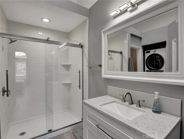 25081 Leucadia St Unit F, Laguna Niguel, CA 92677 - bathroom with a shower stall, vanity, and recessed lighting