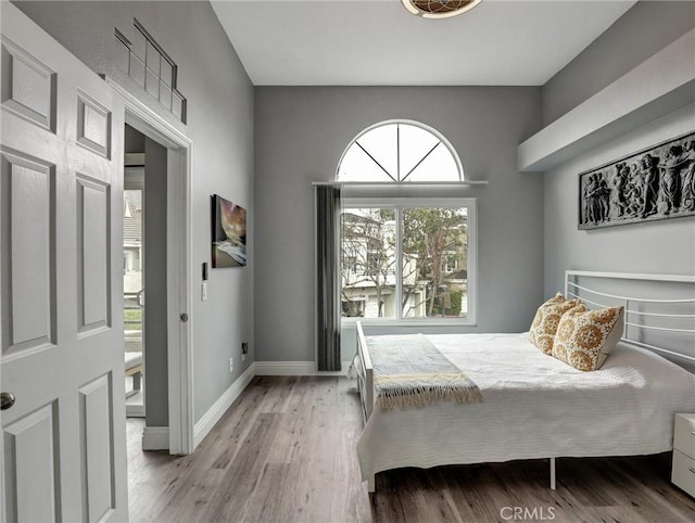 25081 Leucadia St Unit F, Laguna Niguel, CA 92677 - bedroom with light wood-type flooring and baseboards