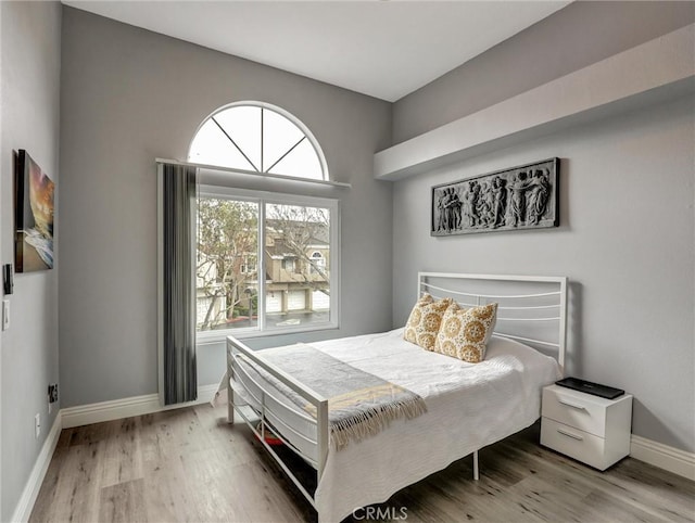 25081 Leucadia St Unit F, Laguna Niguel, CA 92677 - bedroom with wood finished floors and baseboards