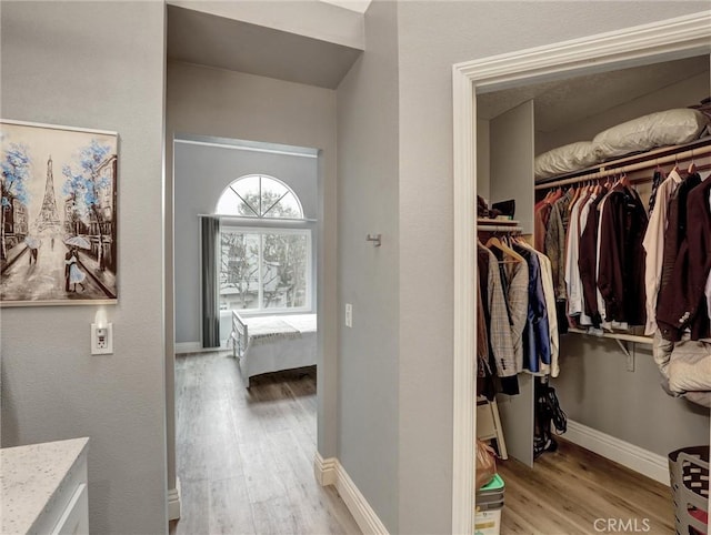 25081 Leucadia St Unit F, Laguna Niguel, CA 92677 - hall with light wood finished floors and baseboards