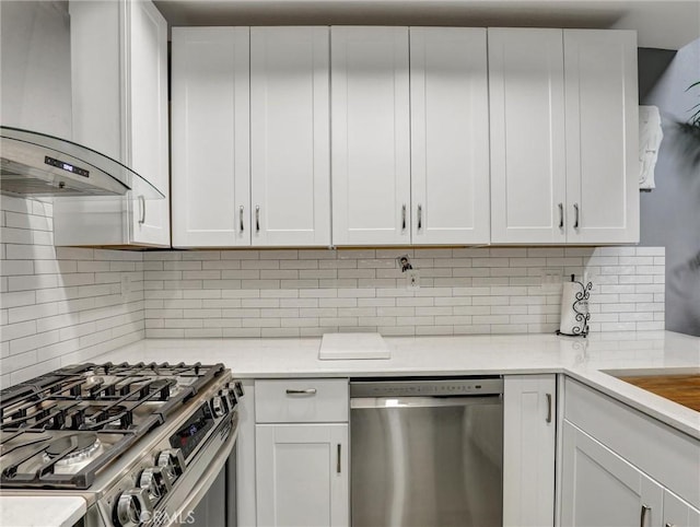 25081 Leucadia St Unit F, Laguna Niguel, CA 92677 - kitchen featuring stainless steel appliances, exhaust hood, backsplash, and white cabinets