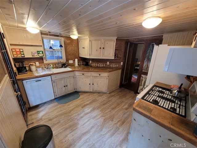 810 Lake Dr, Lake Arrowhead, CA 92352 - kitchen with dishwasher, a sink, light wood-type flooring, tile countertops, and wooden ceiling