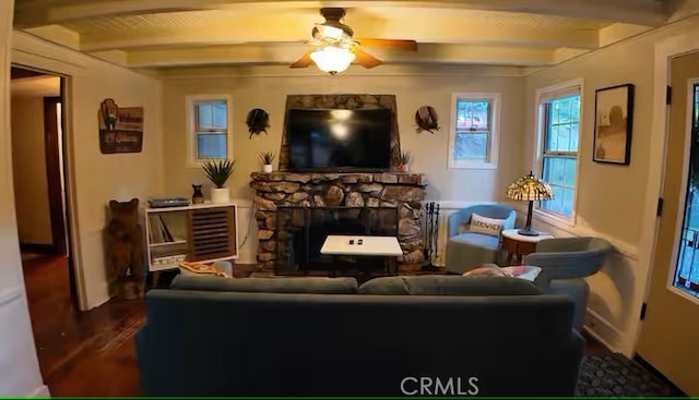 810 Lake Dr, Lake Arrowhead, CA 92352 - living area featuring beam ceiling, a stone fireplace, baseboards, a ceiling fan, and wood finished floors