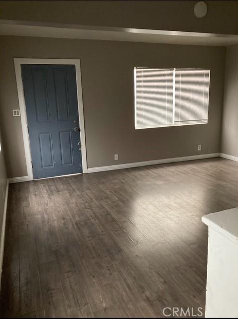 2404 E California, Bakersfield, CA 93307 - unfurnished room featuring wood finished floors and baseboards