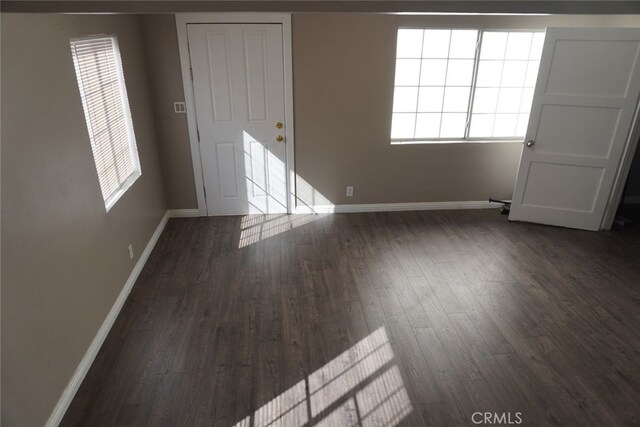 2404 E California, Bakersfield, CA 93307 - empty room featuring baseboards and wood finished floors