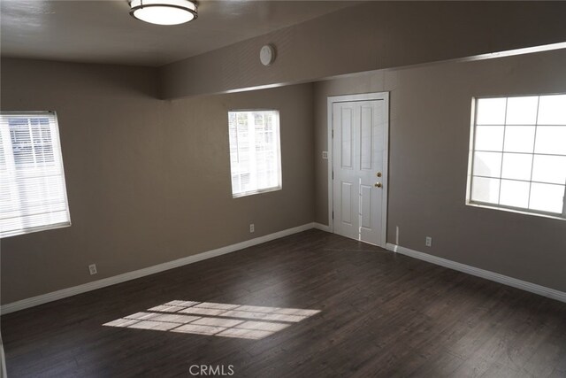 2404 E California, Bakersfield, CA 93307 - unfurnished room featuring dark wood-style flooring and baseboards