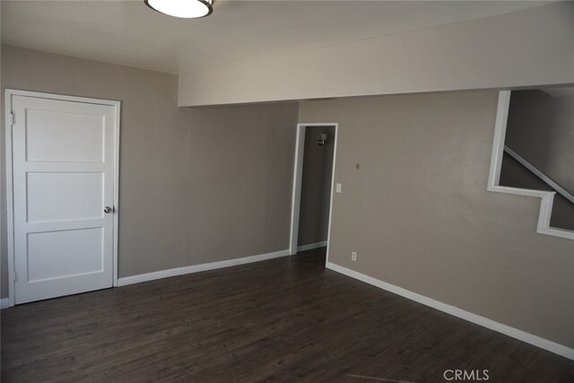 2404 E California, Bakersfield, CA 93307 - empty room with dark wood-style flooring and baseboards