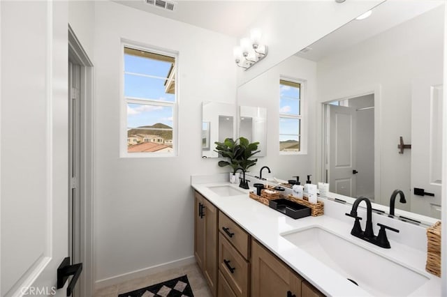 31768 Constellation Dr, Menifee, CA 92586 - full bath with baseboards, double vanity, and tile patterned flooring