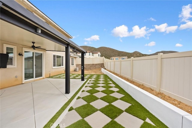 31768 Constellation Dr, Menifee, CA 92586 - view of yard featuring a ceiling fan, a mountain view, and a patio area